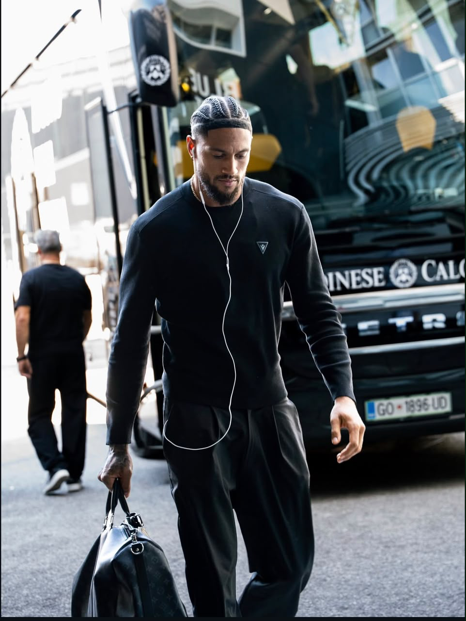 Maduka Emil Okoye walking from the team bus
